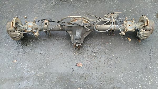 Rear axle beam with reducer