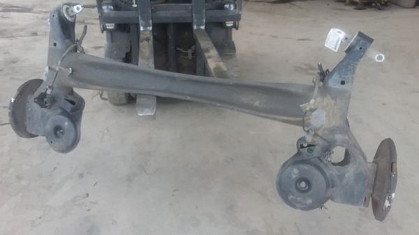 Rear axle beam with reducer