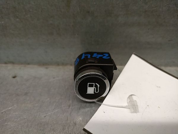 Bouton interrupteur de trappe à essence