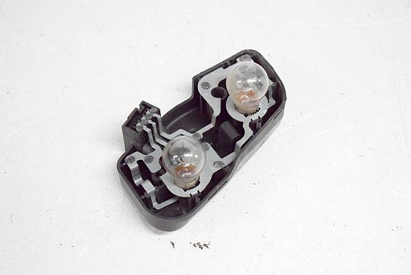 Tail light bulb cover holder