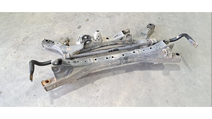 Rear axle beam with reducer