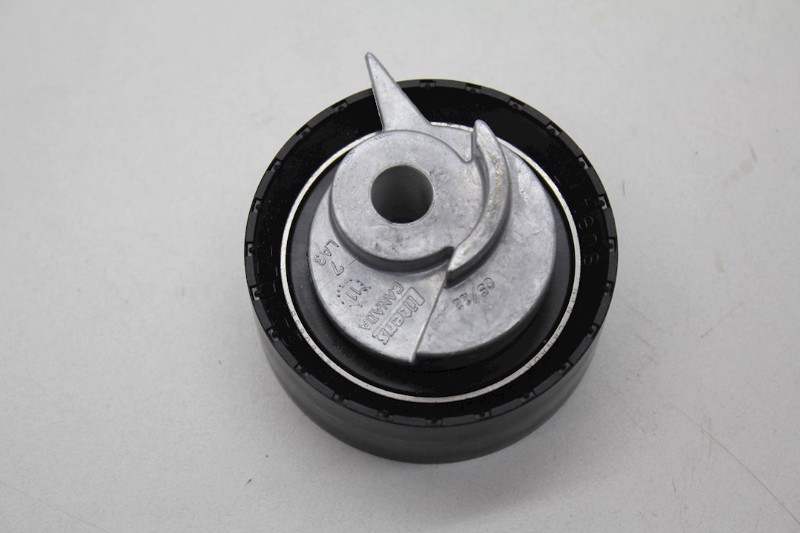 Timing belt chain tensioner